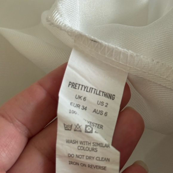 PrettyLittleThing White Long Sleeve Dress with Black Button Accents - Picture 9 of 12